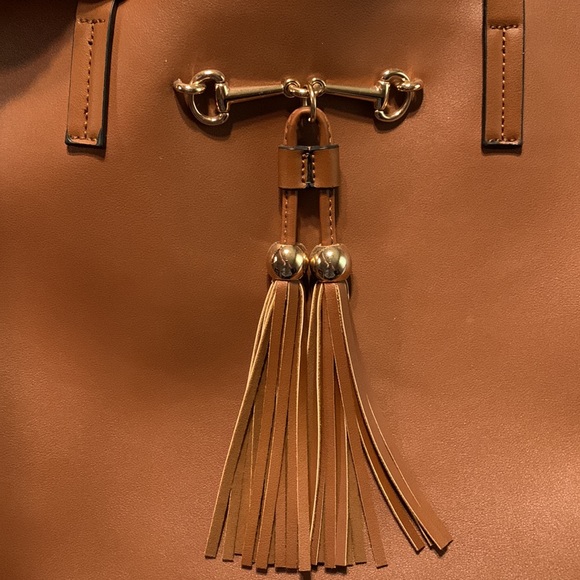 Classic tan faux leather tote with gold tone bit hardware and tassel details. - Picture 2 of 5